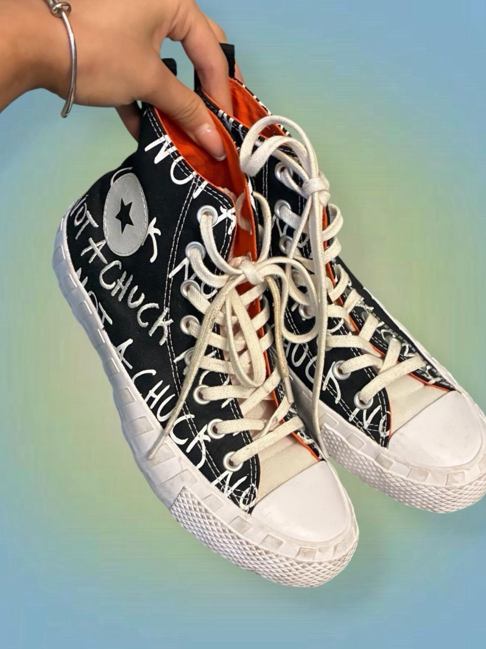 Converse Black & White Graffiti High-Top Sneakers with Orange Lining